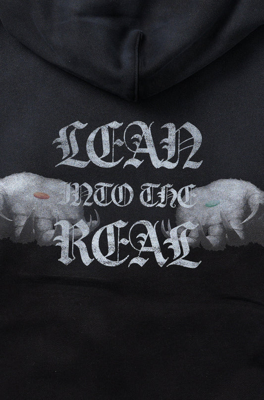 【予約】”LEAN INTO THE REAL” PULLOVER HOODIE BLACK